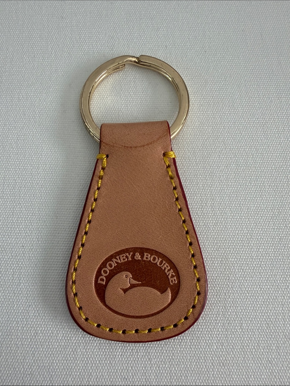 Dooney & Bourke Tan and Brown Leather Key Ring with Gold Tone Ring
